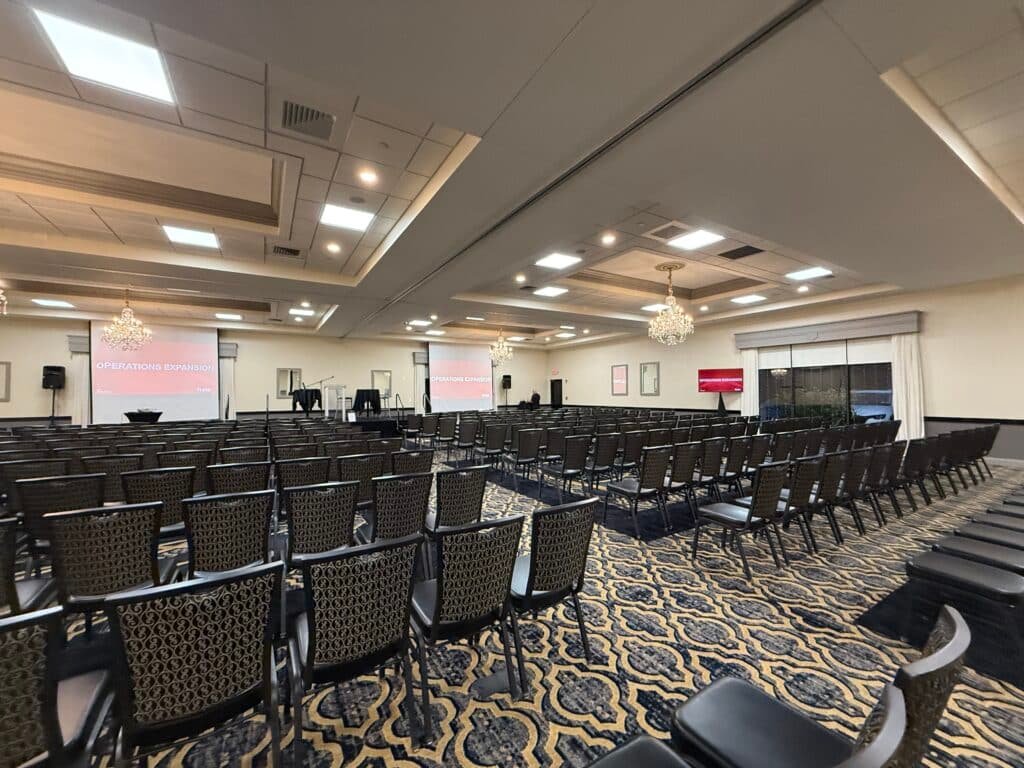 Mongoose AV full stage and lighting setup for Aetna corporate event at Radisson Hotel in Rockford Illinois